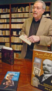 Phil Bishop holds the book used in the movie "the Secret Life of Words." In the forefront are the DVD and Bishop's bibliography of Mosher books.